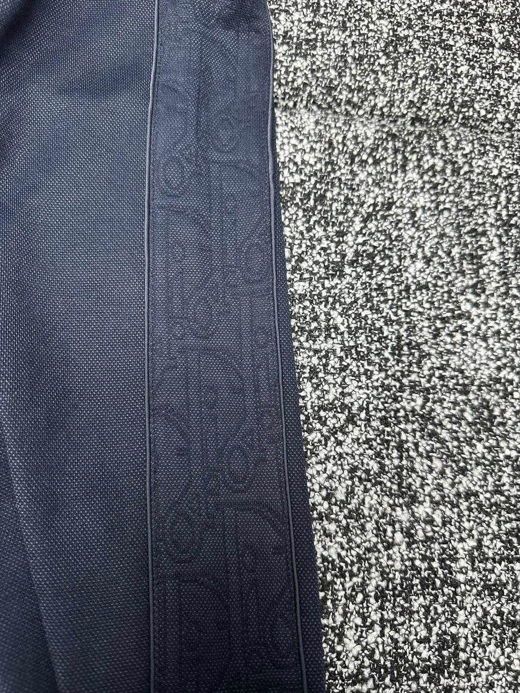 Dior pants side view, slate blue fabric with vertical seam detail