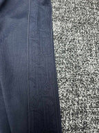 Dior pants side view, slate blue fabric with vertical seam detail