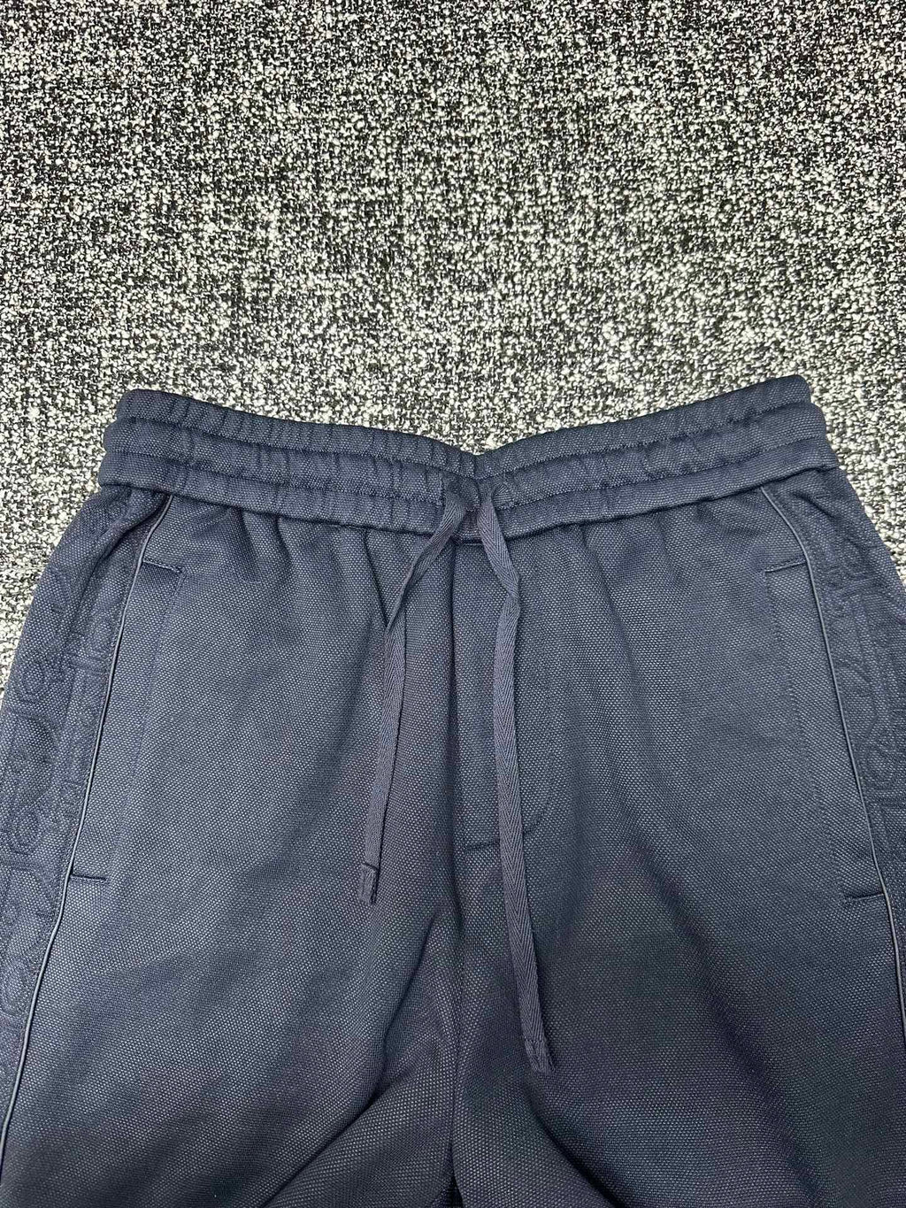 Dior pants, slate blue with elastic waistband, drawstring, and side pockets