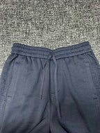 Dior pants, slate blue with elastic waistband, drawstring, and side pockets