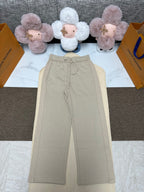 Beige pants with elastic waistband and drawstring, wide-leg fit