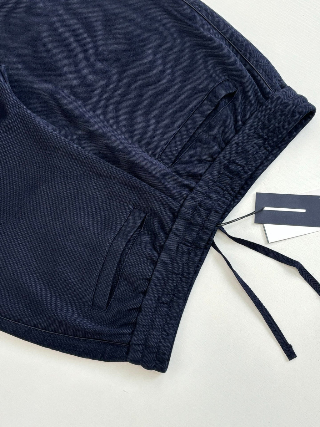 Navy drawstring waist pants with gathered hem and tag attached