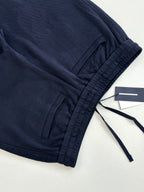 Navy drawstring waist pants with gathered hem and tag attached