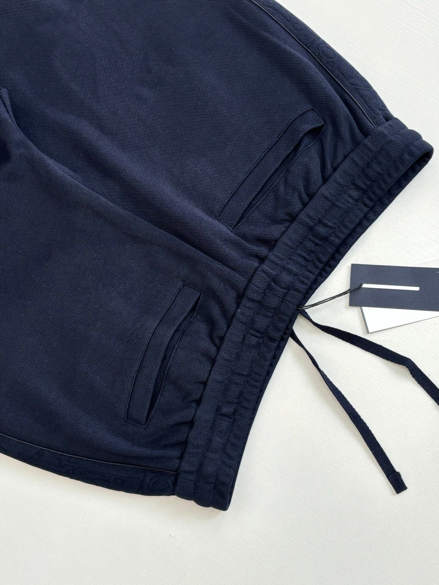 Navy drawstring waist pants with gathered hem and tag attached
