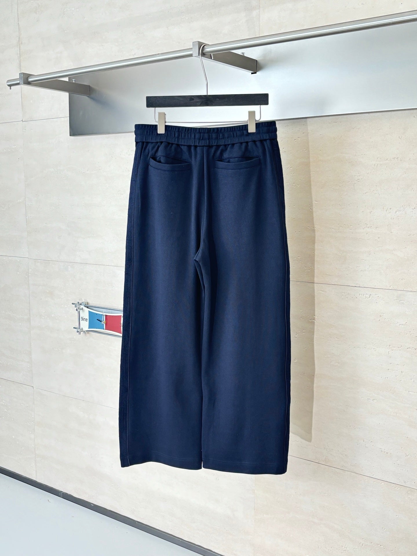 Navy drawstring waist pants, straight wide-leg silhouette