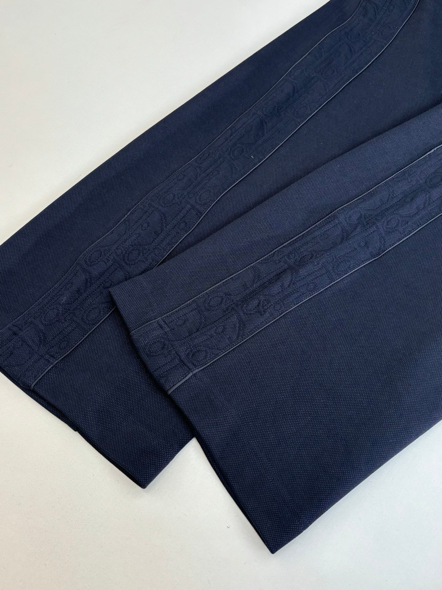 Navy pants with tonal jacquard texture and straight leg panels
