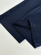 Navy pants with drawstring waistband and structured side pockets