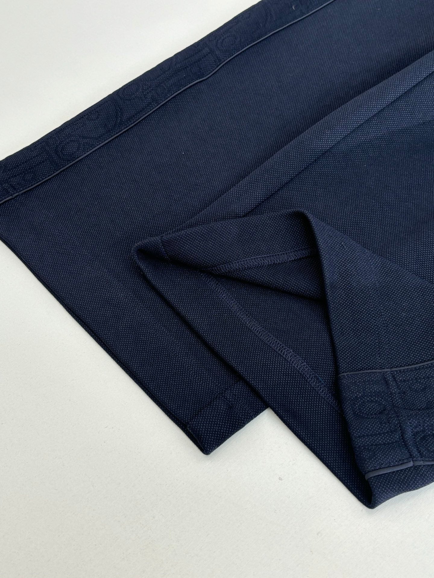 Navy pants with drawstring waistband and structured side pockets