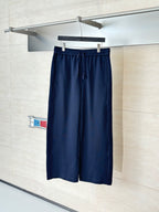 Navy drawstring waist pants with relaxed wide legs