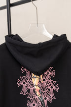 Black zip hoodie back with large pink floral graphic across the chest