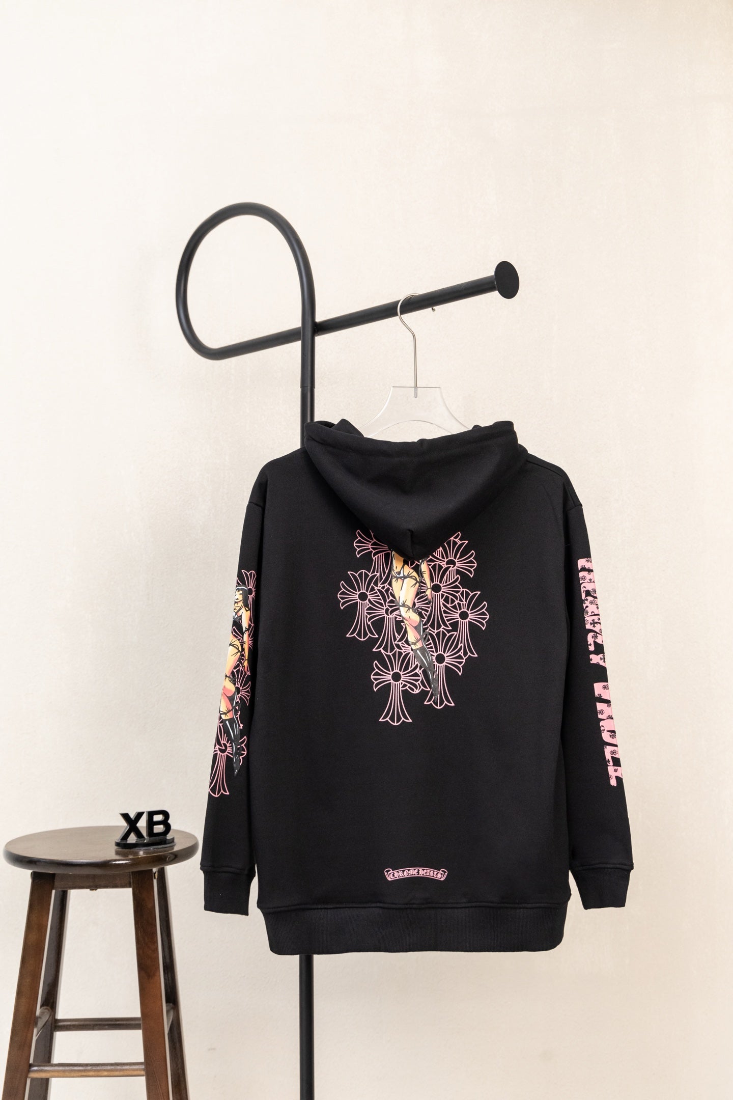 Black zip hoodie with large pink floral graphic on the back and hood