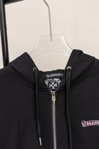 Black zip hoodie hood with drawstrings and silver zipper hardware