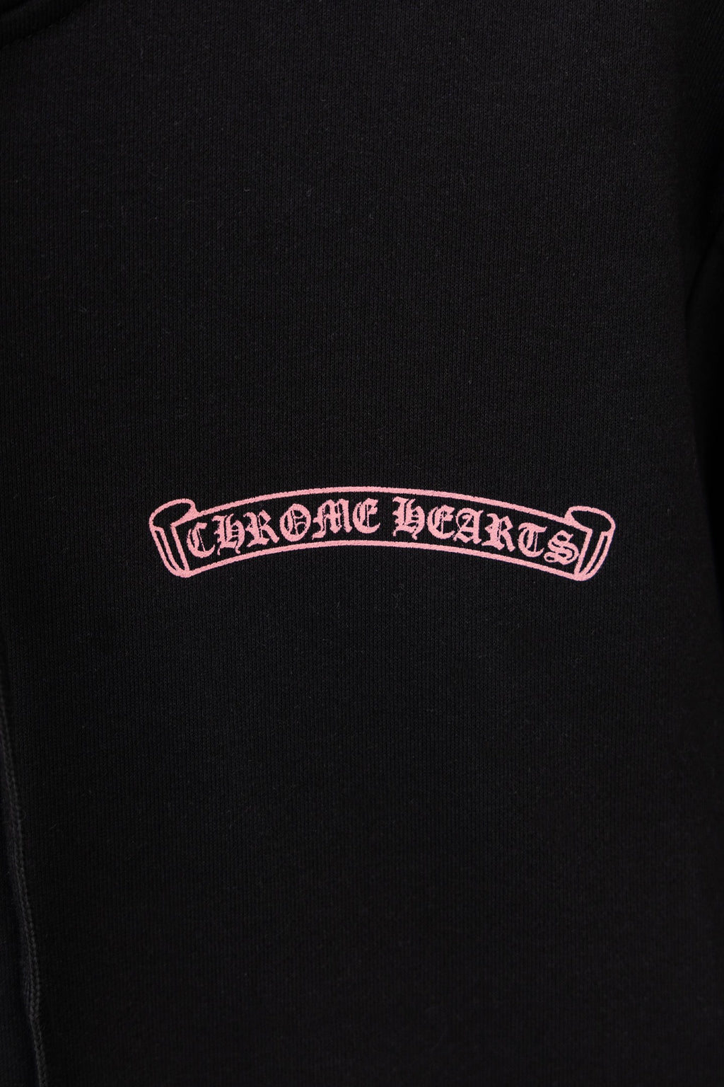 Black long-sleeve zip hoodie with Chrome Hearts logo on chest