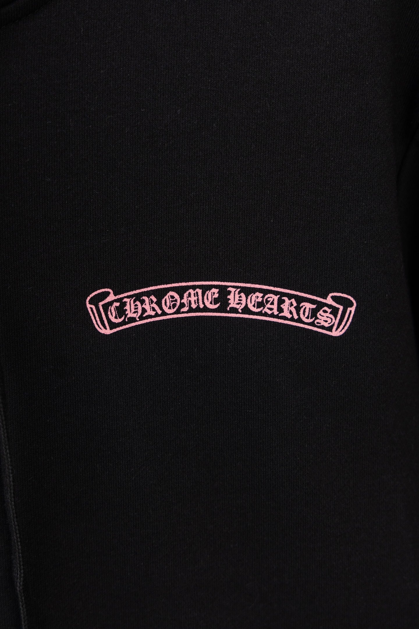 Black long-sleeve zip hoodie with Chrome Hearts logo on chest