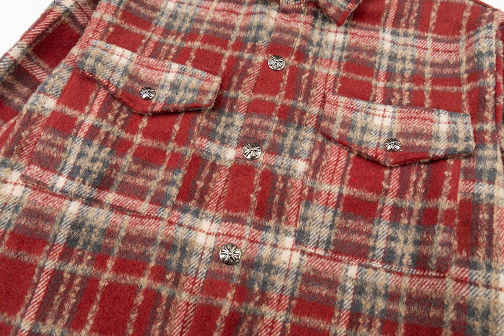 Red plaid shirt jacket with chest pockets, flap details, and small round buttons