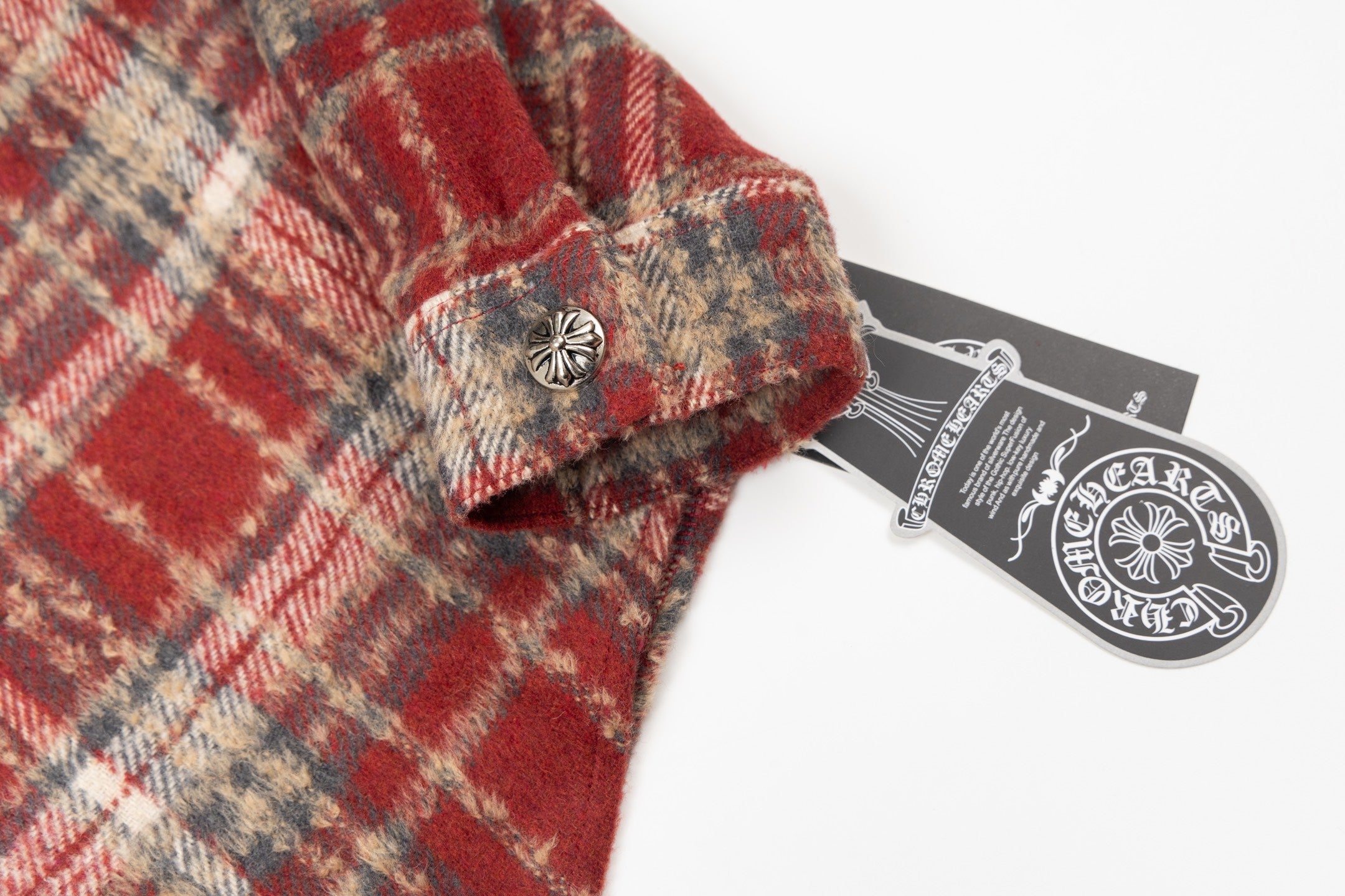Chrome long clothes plaid fabric with round metallic button and hanging tag