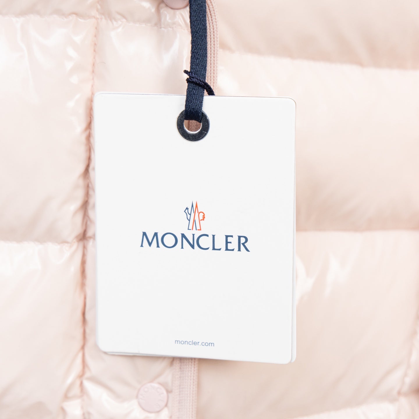 Light pink hooded puffer jacket with Moncler hang tag