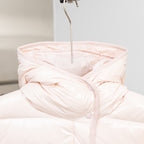 Light pink hooded puffer jacket with hood and buttoned front placket