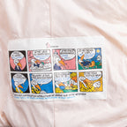 Light pink Moncler puffer jacket front panel with comic-style graphic instructions