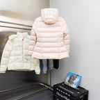 Long hooded puffer jacket, light pink, front zipper and logo patch