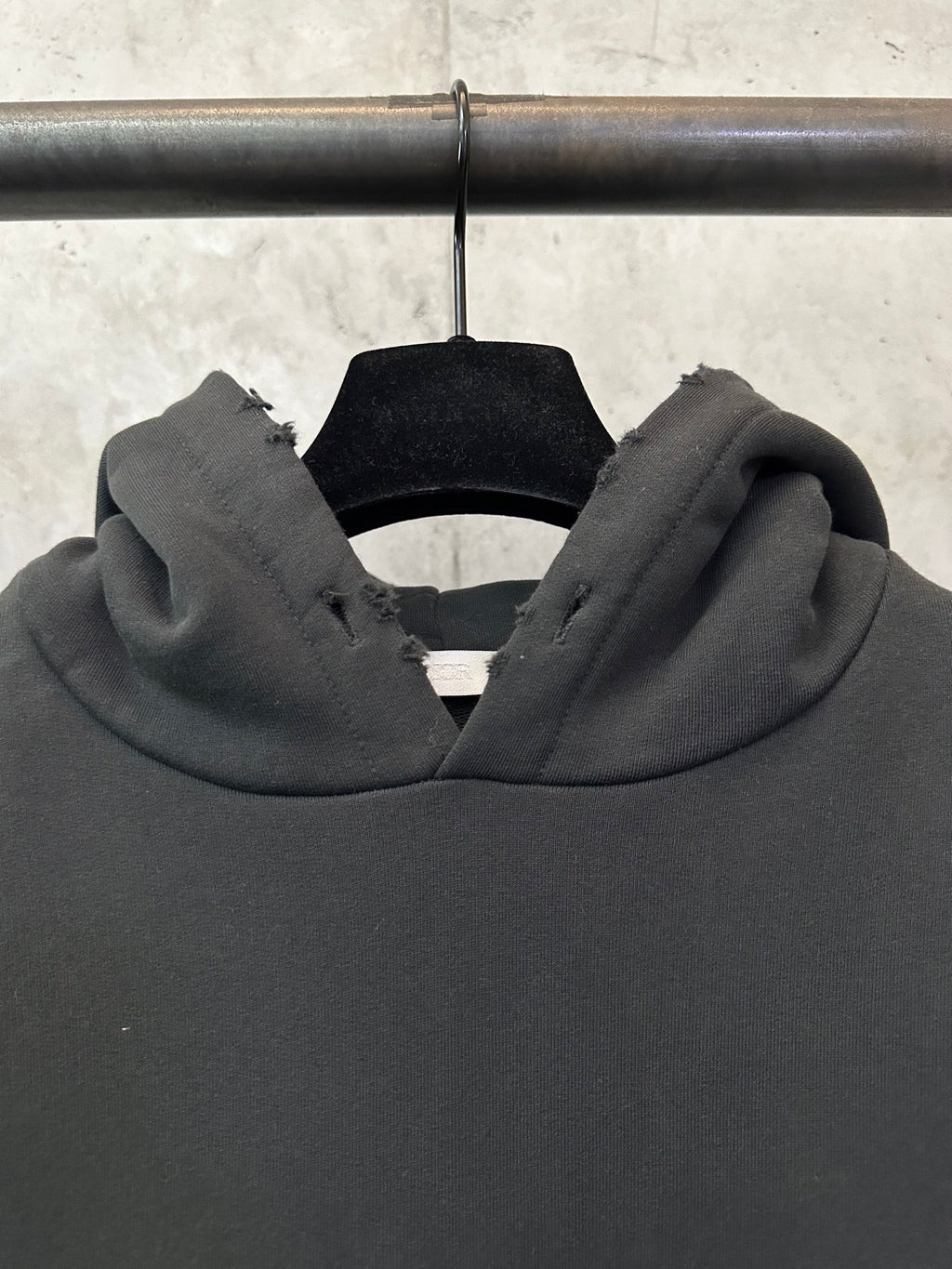 Black Dior hood with thick hood opening and soft neck area.