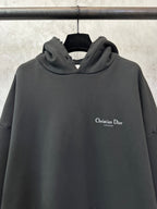 Black Dior hooded sweatshirt with small chest logo on the front.