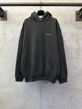Black Dior hooded sweatshirt with front pocket and small chest logo.