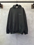 Black Dior hooded sweatshirt with front pocket and small chest logo.