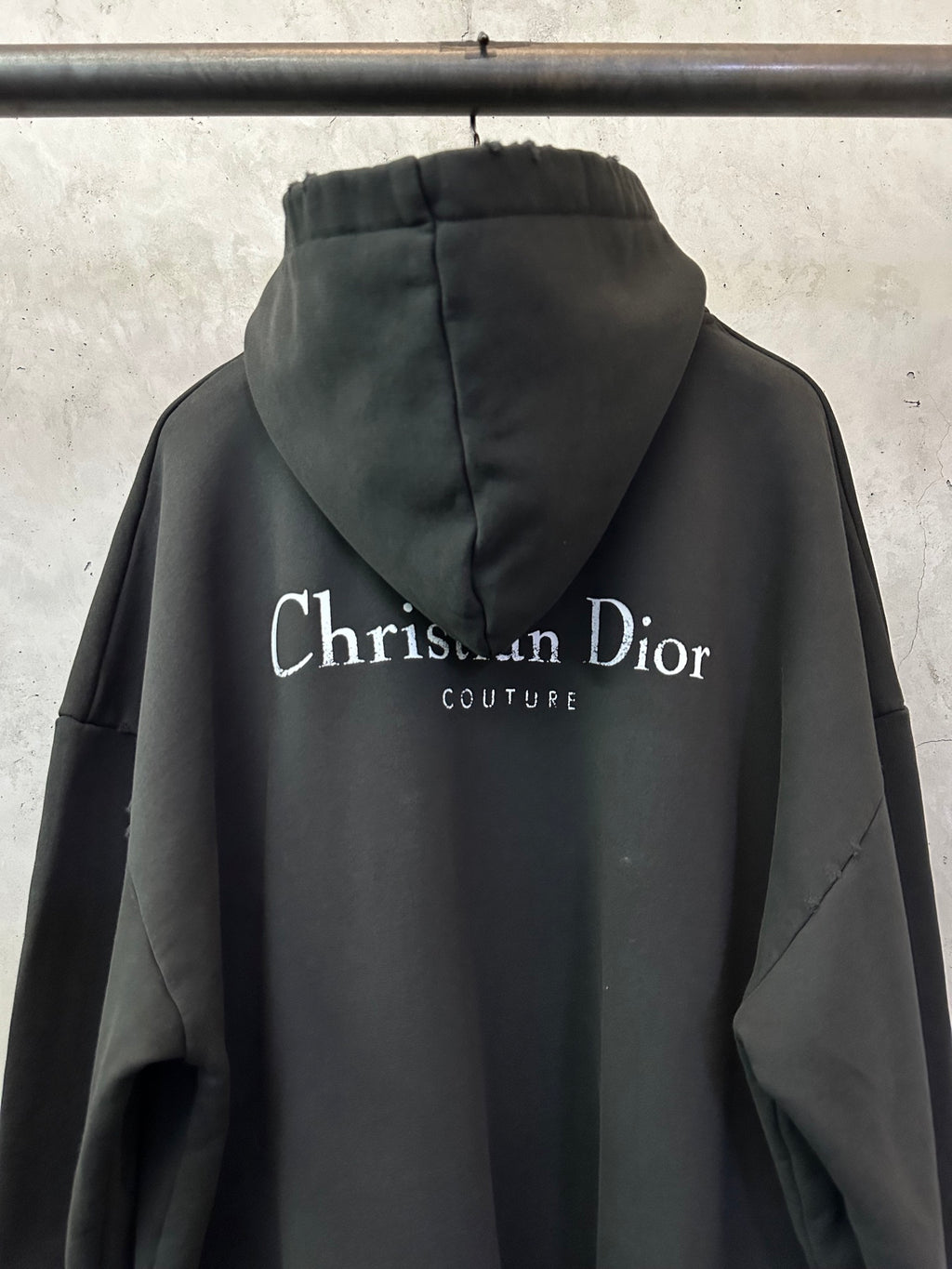 Black Dior hooded sweatshirt with large back logo and Couture text.