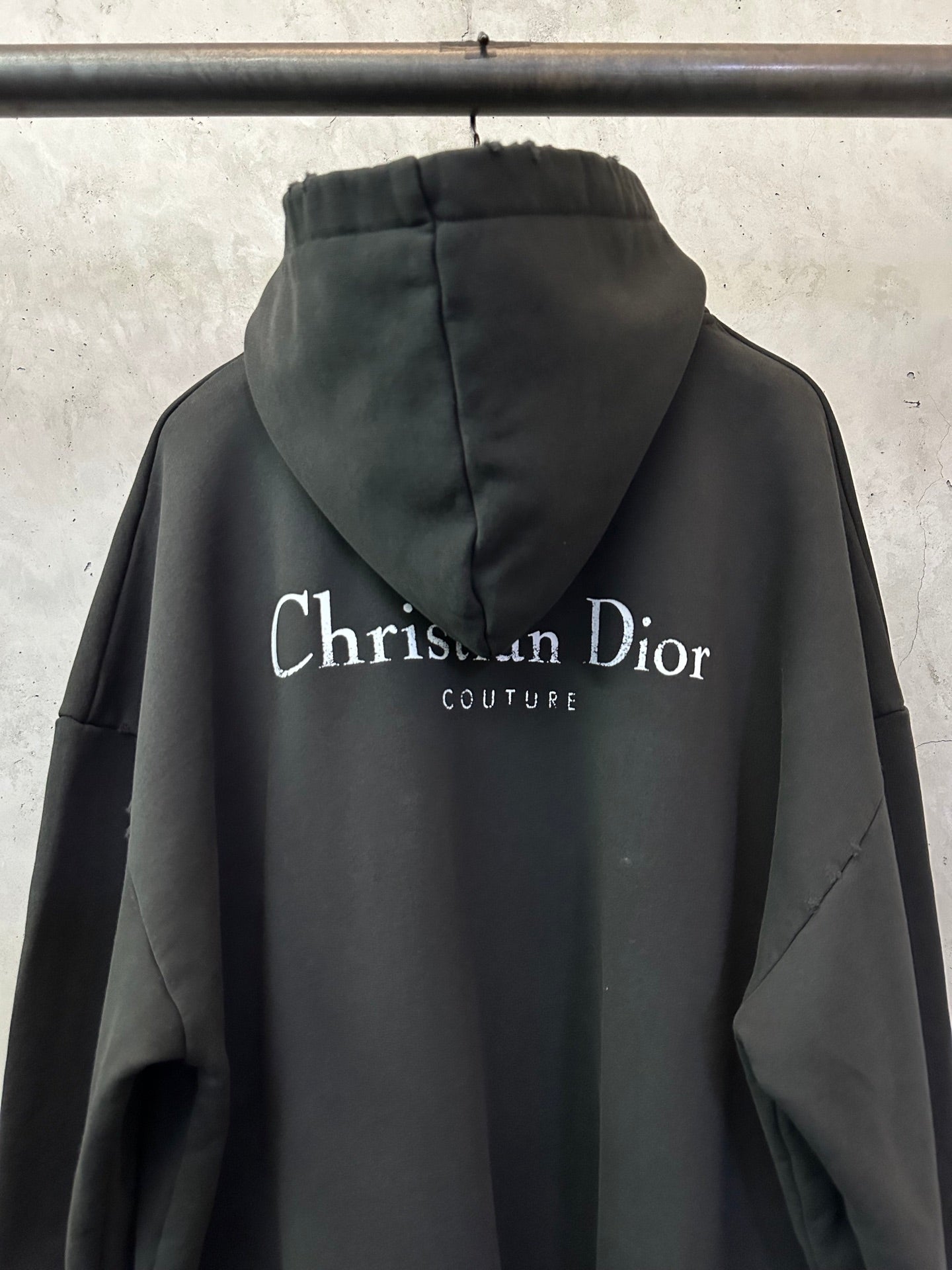 Black Dior hooded sweatshirt with large back logo and Couture text.