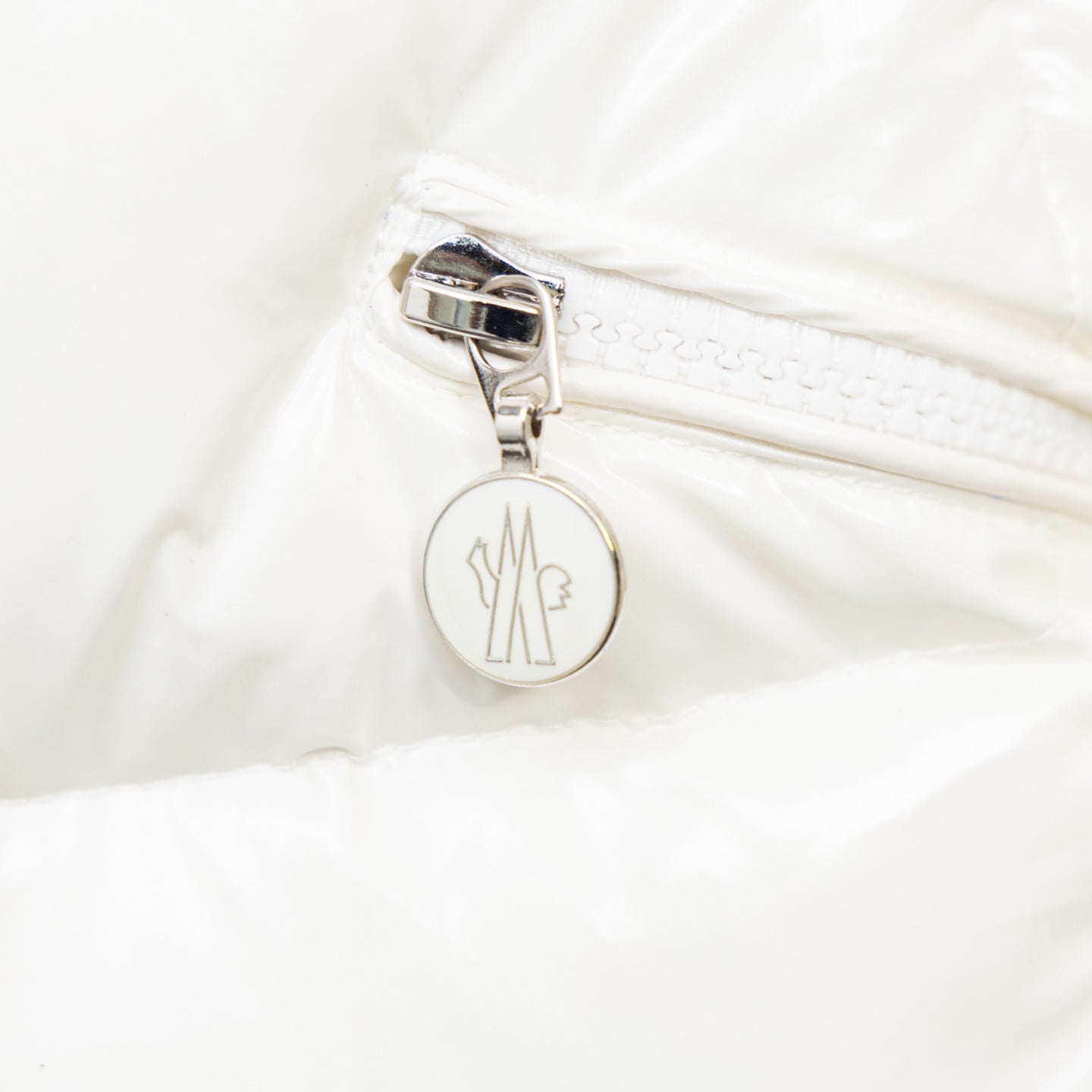 Moncler long puffer jacket, white zipper with round logo charm and metal pull