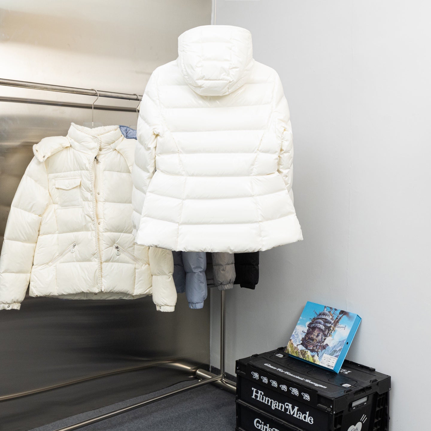 Moncler long white hooded puffer jacket, front view with layered padded quilting