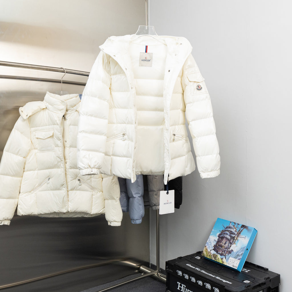 Moncler long white hooded puffer jacket, side view with hanging brand tag
