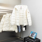 Moncler long white hooded puffer jacket, side view with hanging brand tag