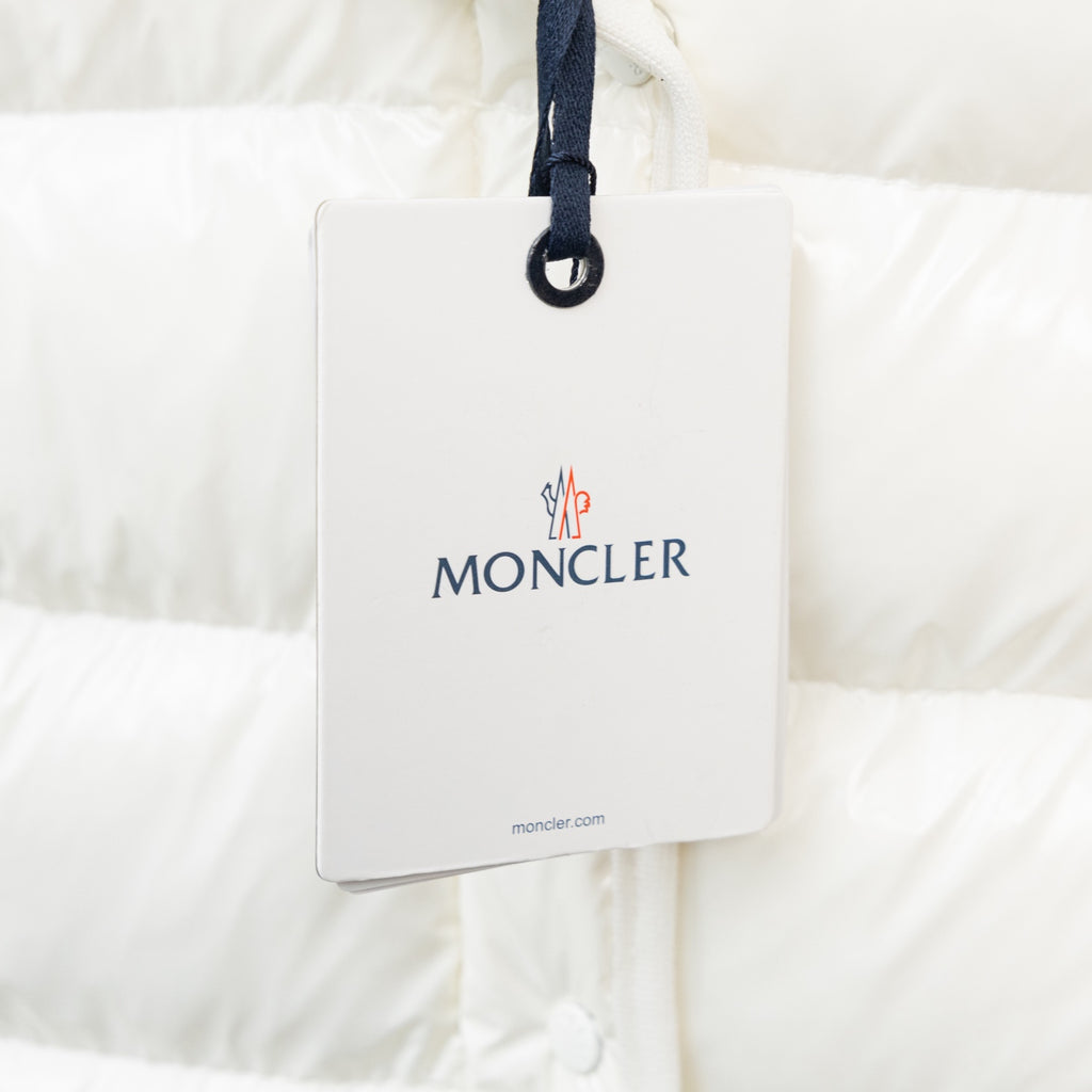 Moncler long white puffer jacket, white hang tag with Moncler logo