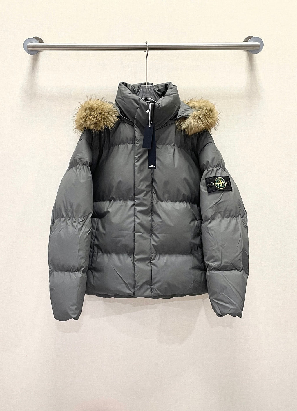 Stone Island down puffer jacket with faux fur hood trim, dark gray, front zip
