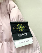 Stone Island down jacket sleeve with black brand patch label and care icons