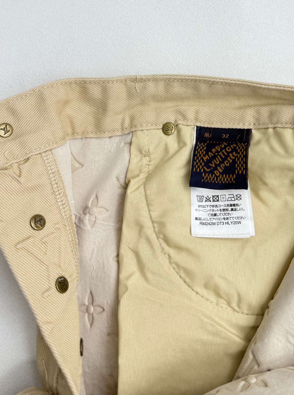 Beige Louis Vuitton monogram pants with interior size label