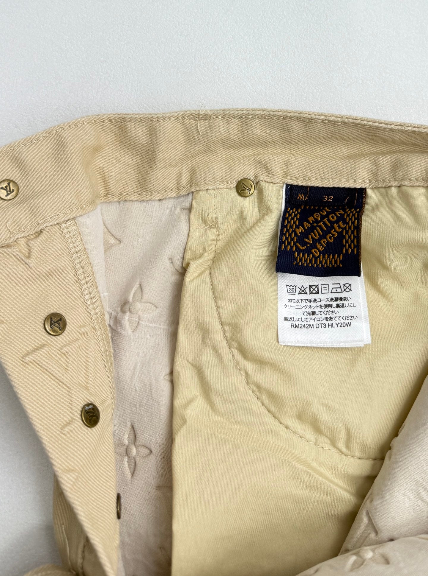Beige Louis Vuitton monogram pants with interior size label