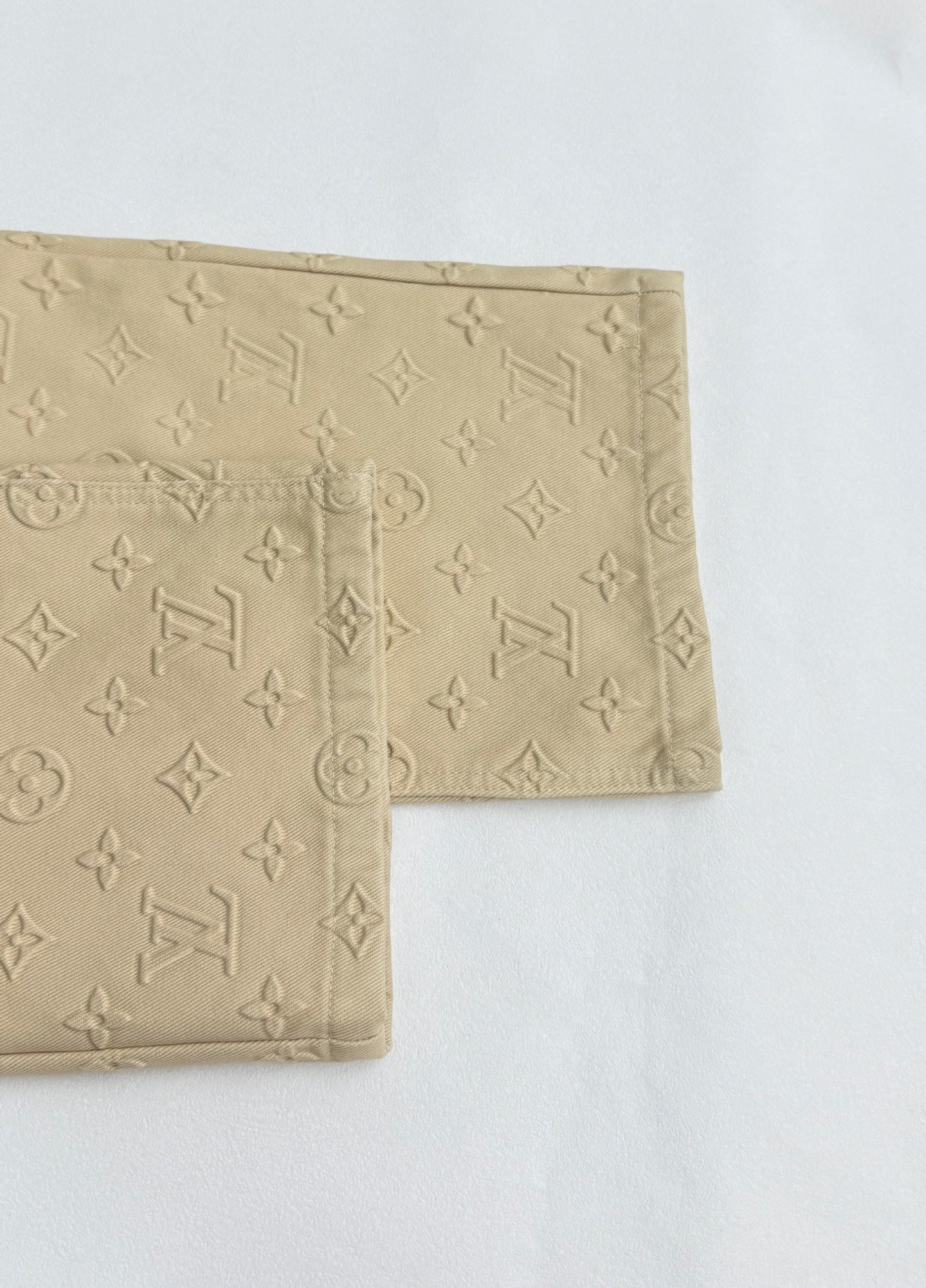 Beige Louis Vuitton monogram pants leg with folded cuff hem