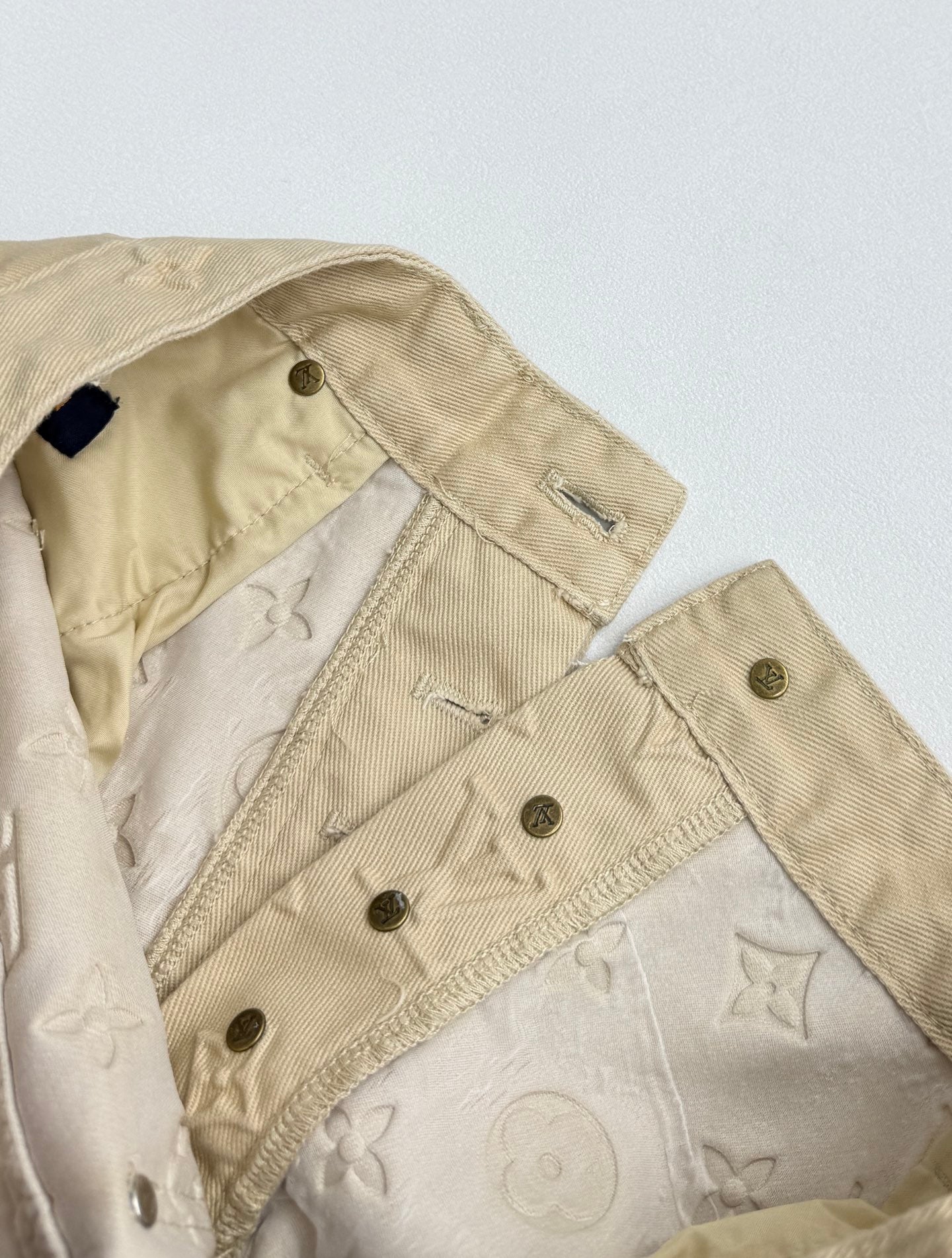 Beige Louis Vuitton monogram pants with buttoned fly and side pocket trim