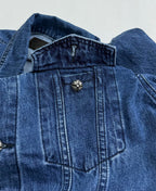 Denim jacket shoulder and chest with decorative button detail on yoke