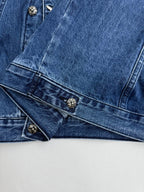 Denim jacket cuffs and chest area with snap-button details
