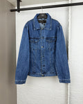 Blue denim jacket with button front, pointed collar, and chest pockets