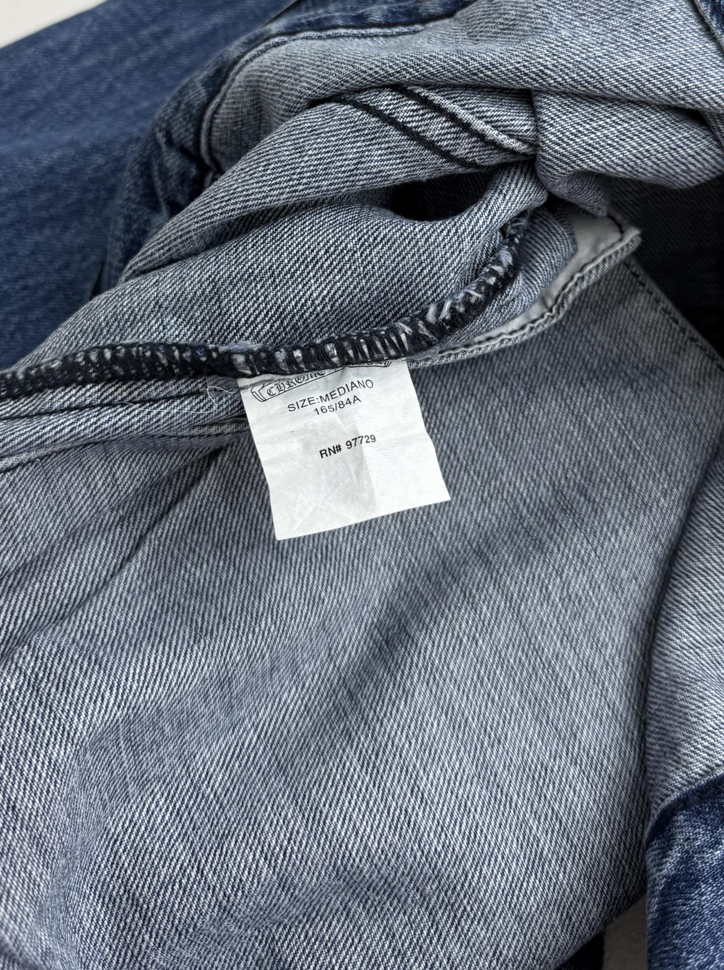 Denim jacket inside neckline with woven care label tag
