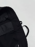 Louis Vuitton black pants pocket area with tied drawcord