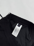 Louis Vuitton black pants interior with white size and care label