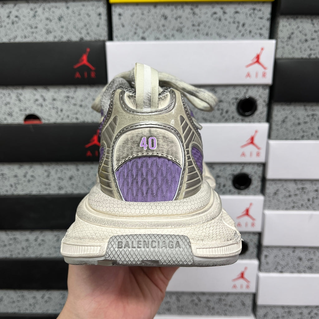 Unisex sneakers back view with purple heel panel and chunky sole