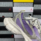 Unisex sneakers heel-toe side view with purple vertical panel and light gray upper