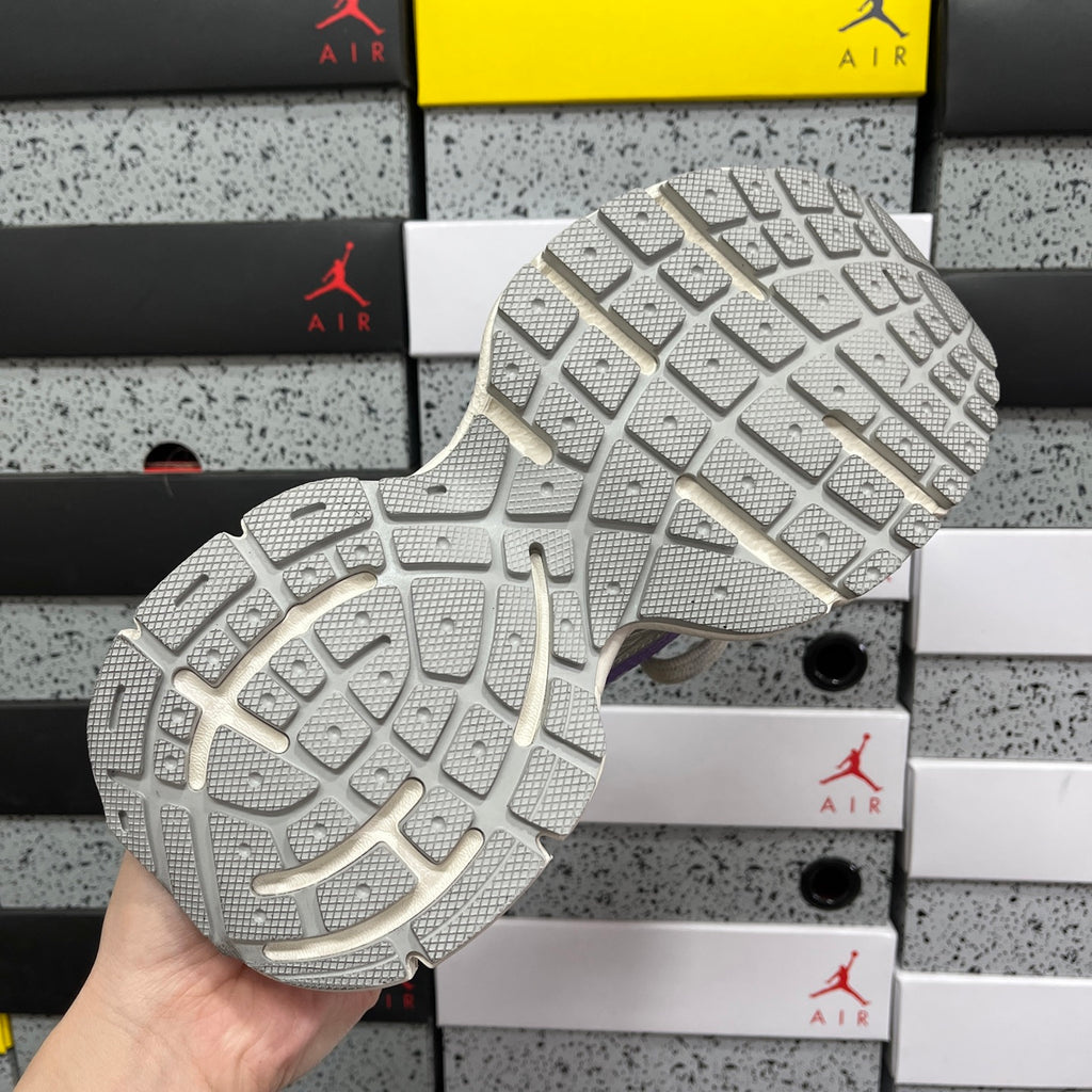 Unisex sneaker outsole view with textured tread pattern on chunky sole